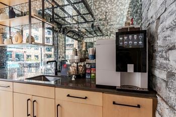 A kitchen with a counter top and a sink